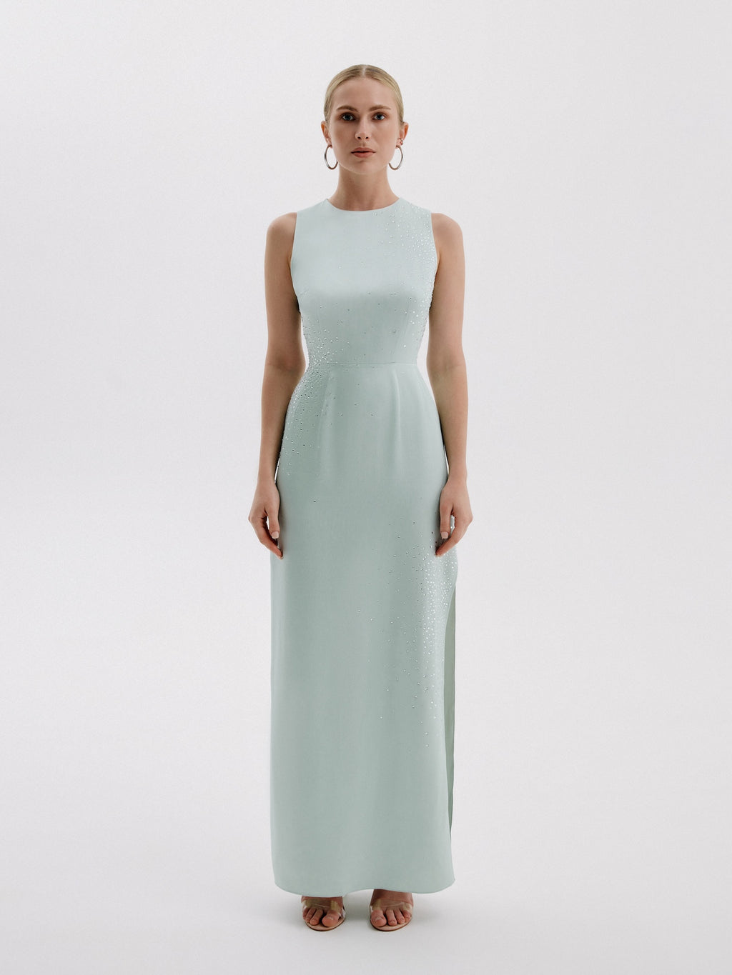 Front view of sleeveless mint evening gown with subtle sparkle.